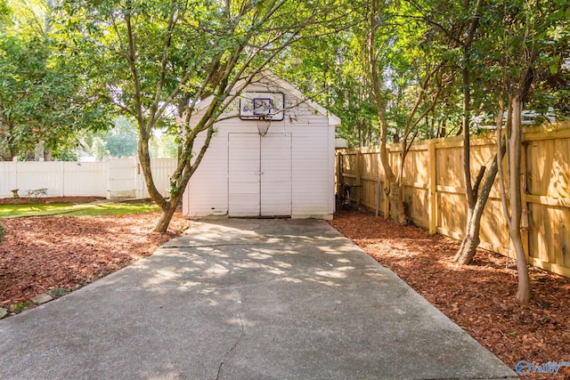 view of patio / terrace with a shed