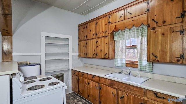 kitchen with white electric range oven, sink, and water heater