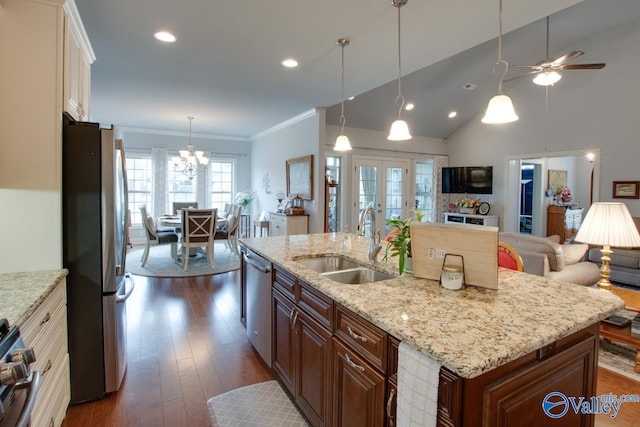 kitchen with crown molding, an island with sink, dark hardwood / wood-style floors, appliances with stainless steel finishes, and sink