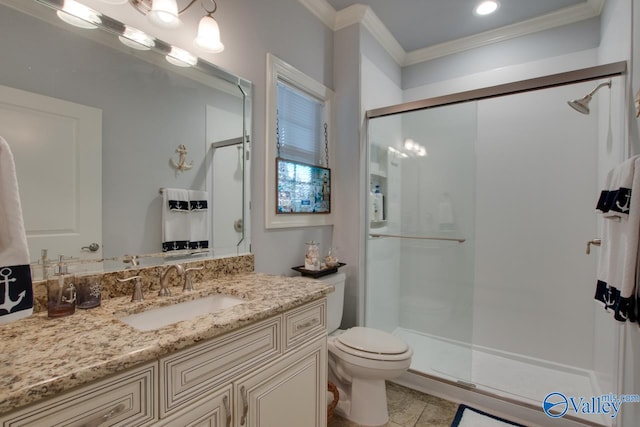 bathroom with vanity, tile patterned floors, ornamental molding, toilet, and a shower with door