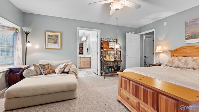 carpeted bedroom featuring ceiling fan and ensuite bathroom