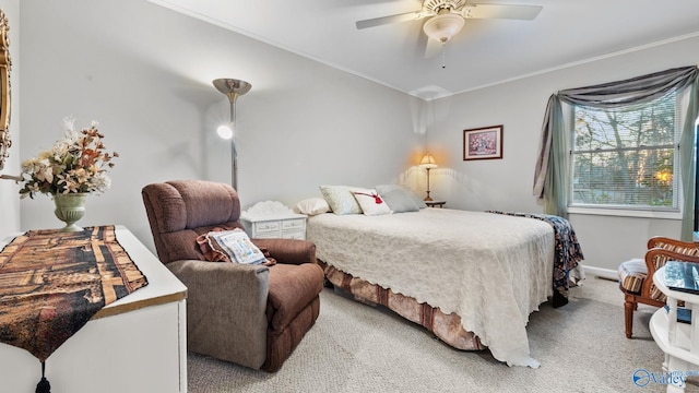 carpeted bedroom featuring ceiling fan and ornamental molding