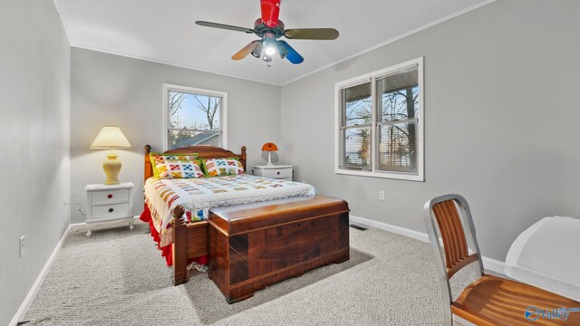 bedroom with light carpet, ceiling fan, and ornamental molding