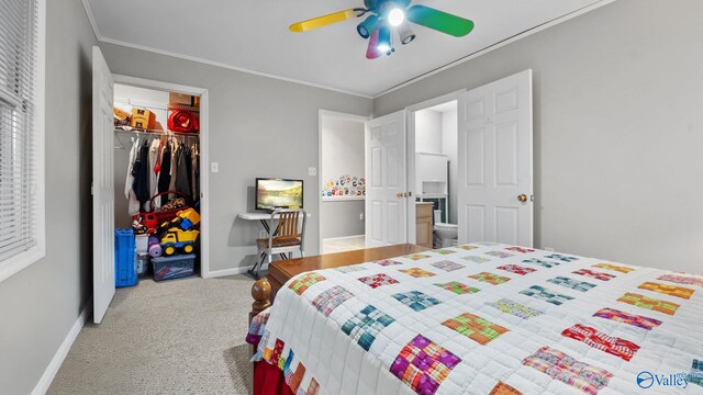 bedroom with carpet flooring, a closet, ceiling fan, and ornamental molding