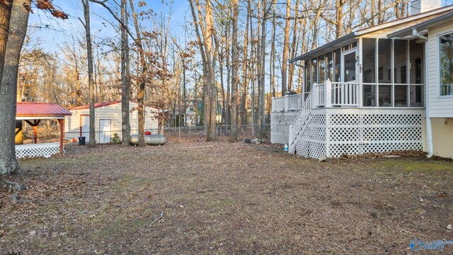 view of yard with a sunroom