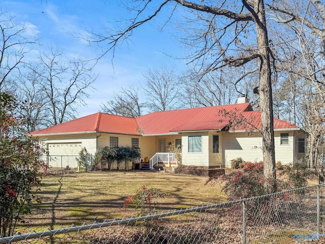 ranch-style house featuring a garage and a front yard