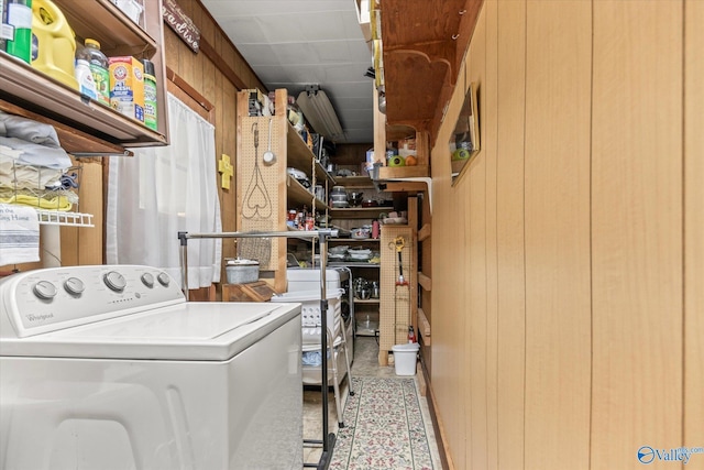 laundry area with washer / clothes dryer, wooden walls, and laundry area