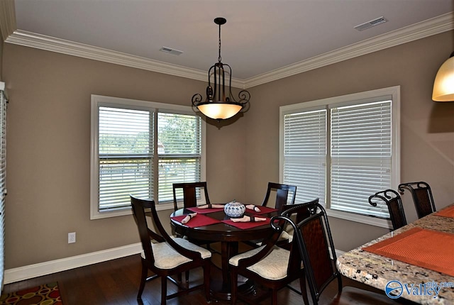 dining area with dark hardwood / wood-style floors and ornamental molding