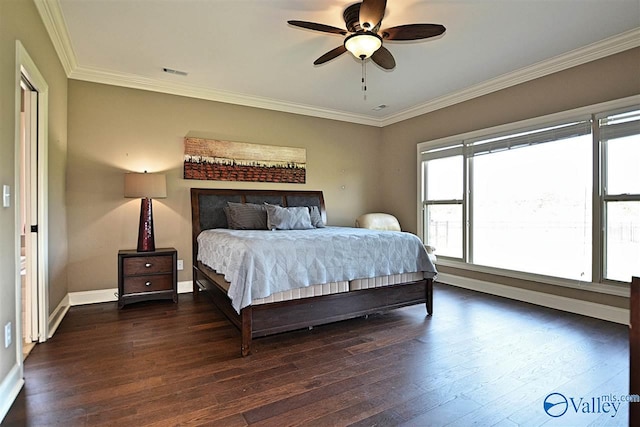 bedroom with dark hardwood / wood-style floors, ceiling fan, and crown molding