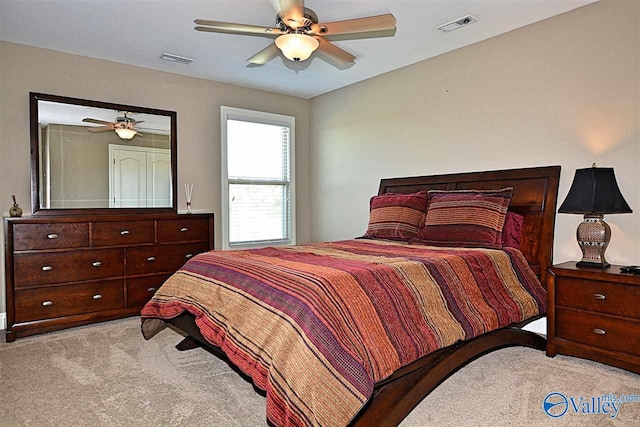 carpeted bedroom with ceiling fan