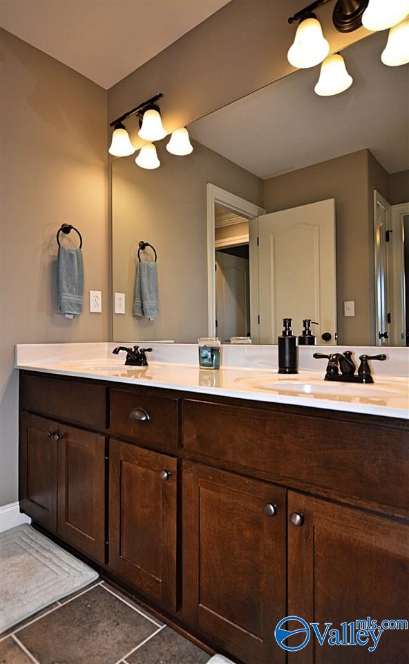 bathroom featuring tile patterned flooring and vanity