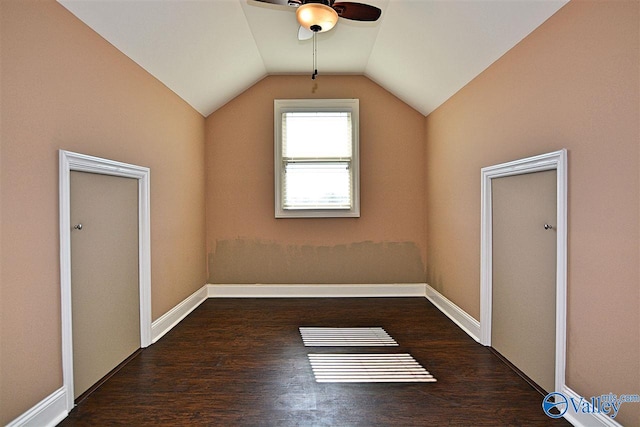 additional living space featuring dark hardwood / wood-style flooring, ceiling fan, and lofted ceiling