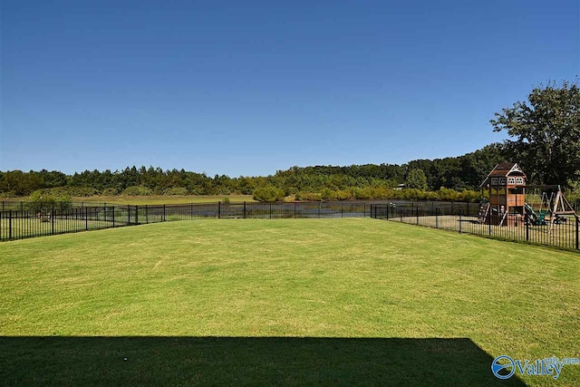 view of yard featuring a rural view and a playground