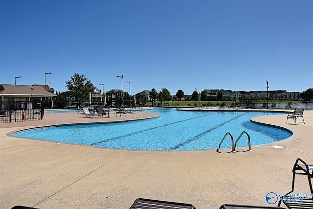 view of swimming pool featuring a patio