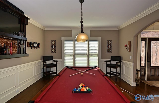 recreation room with crown molding, dark wood-type flooring, and pool table