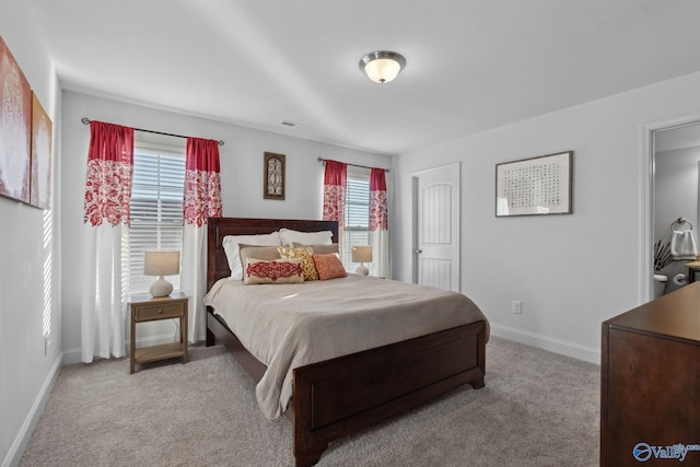 bedroom with light carpet