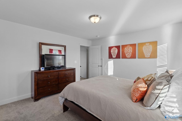 bedroom with light colored carpet