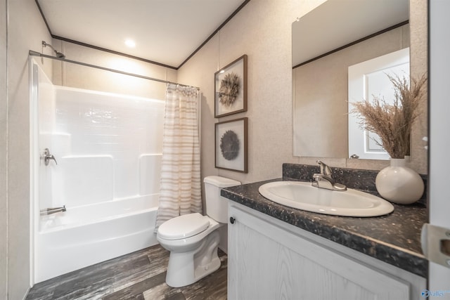 full bathroom featuring hardwood / wood-style flooring, shower / bath combo, vanity, ornamental molding, and toilet