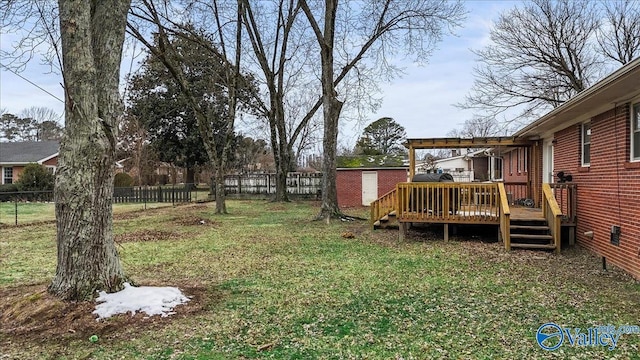 view of yard with a storage shed and a wooden deck