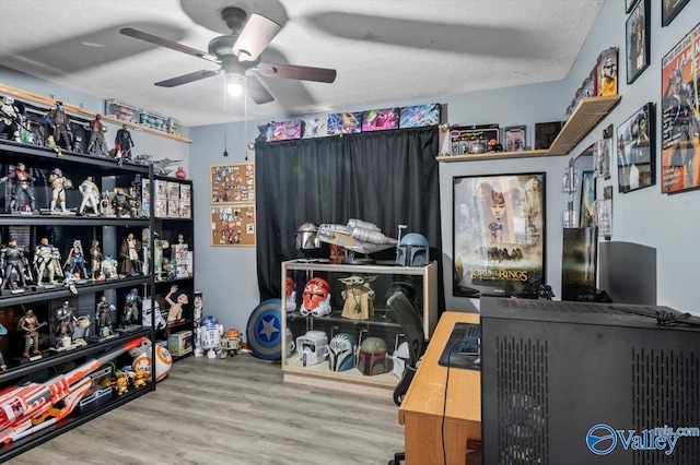 interior space with ceiling fan