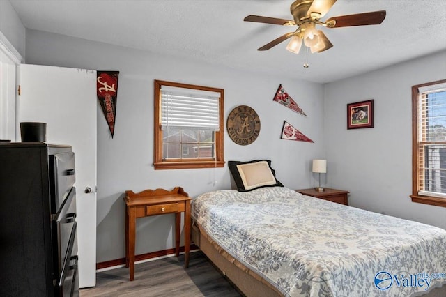 bedroom featuring hardwood / wood-style flooring and ceiling fan