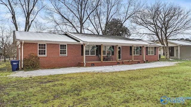 ranch-style house with a front lawn and a porch