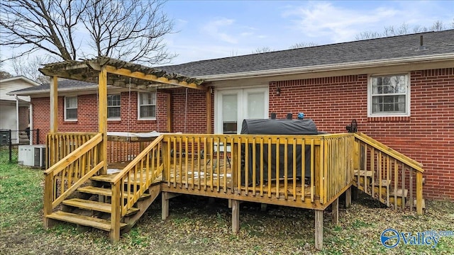 back of property with a deck