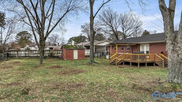 view of yard with a shed and a deck