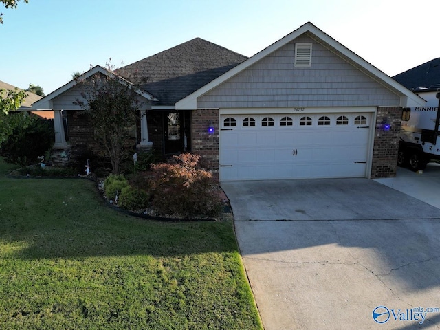 view of front facade featuring a garage and a front lawn