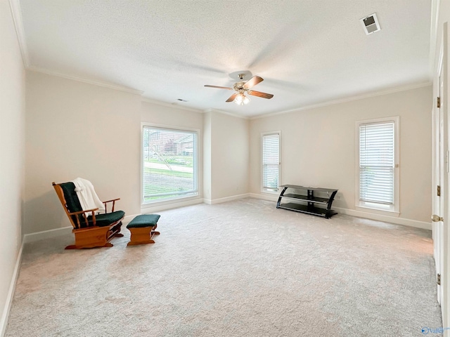 sitting room featuring baseboards, a ceiling fan, visible vents, and carpet flooring