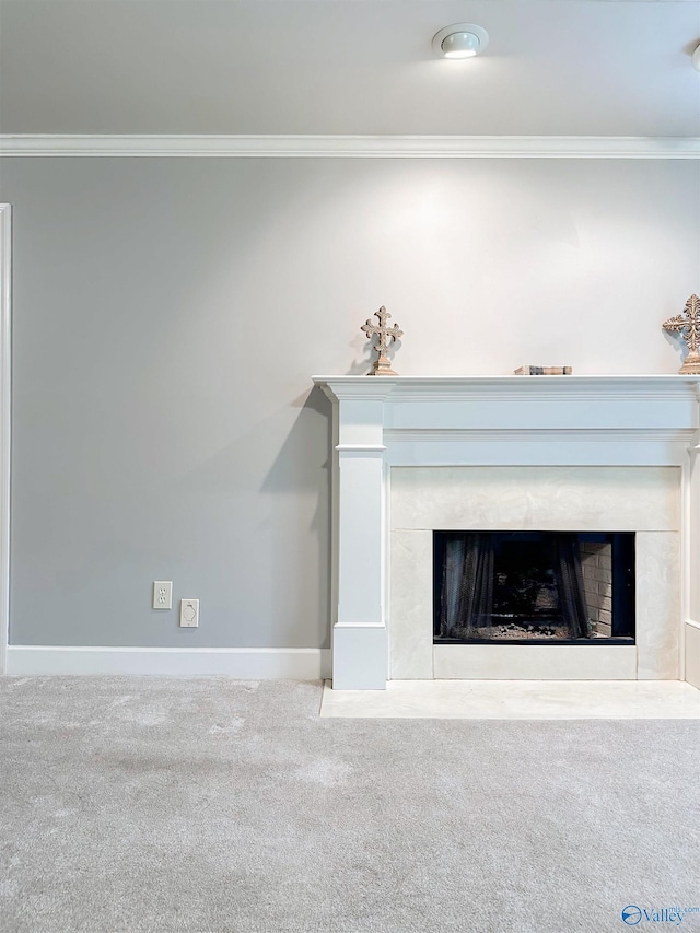 interior details featuring baseboards, carpet floors, a high end fireplace, and crown molding