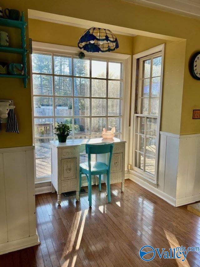 home office featuring hardwood / wood-style flooring and ornamental molding