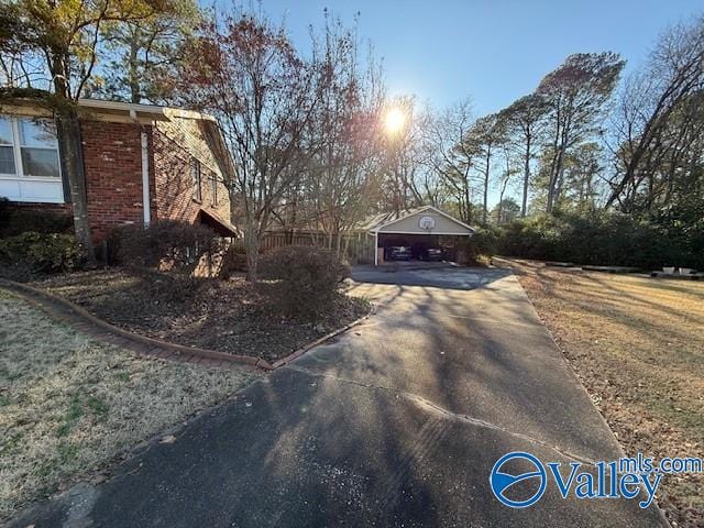 view of side of home with a garage