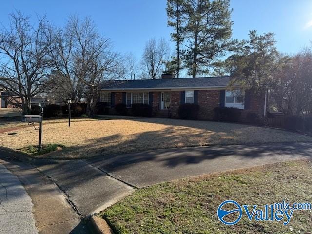 ranch-style home with a front yard