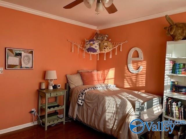 bedroom with crown molding, ceiling fan, and dark wood-type flooring