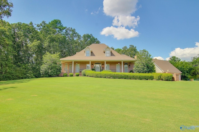 view of front facade with a front yard and a porch