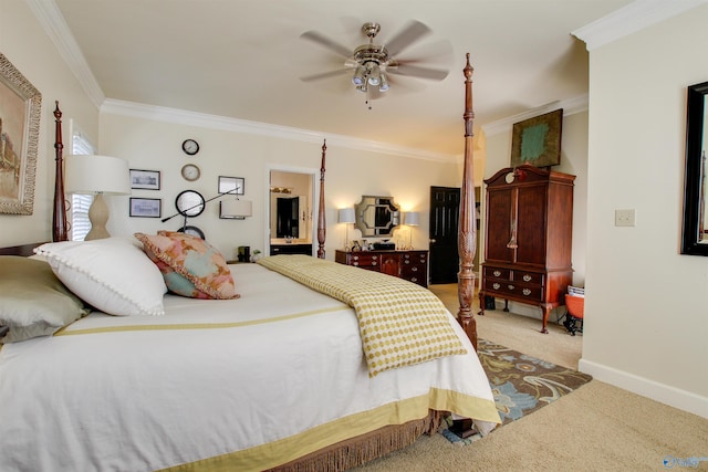 carpeted bedroom with ensuite bath, a ceiling fan, baseboards, and ornamental molding