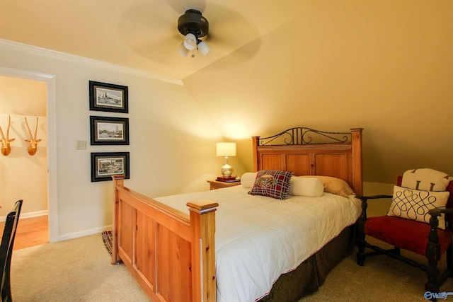 bedroom with baseboards, light carpet, ornamental molding, and a ceiling fan