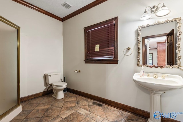 bathroom featuring sink, walk in shower, crown molding, a textured ceiling, and toilet