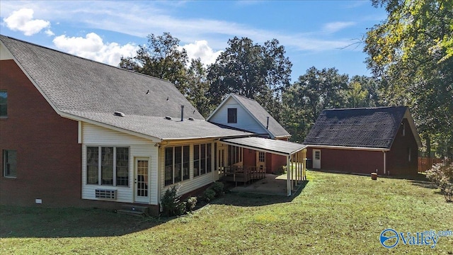 back of property featuring a yard and a patio