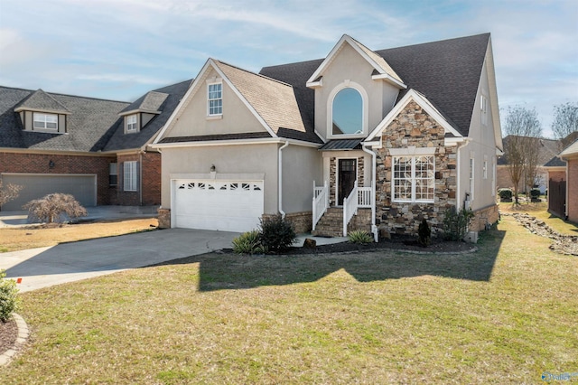 view of front facade featuring a front yard, stone siding, driveway, and stucco siding