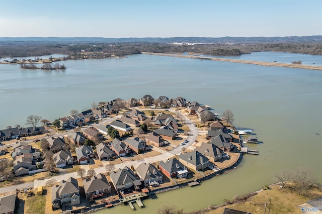 drone / aerial view with a water view and a residential view