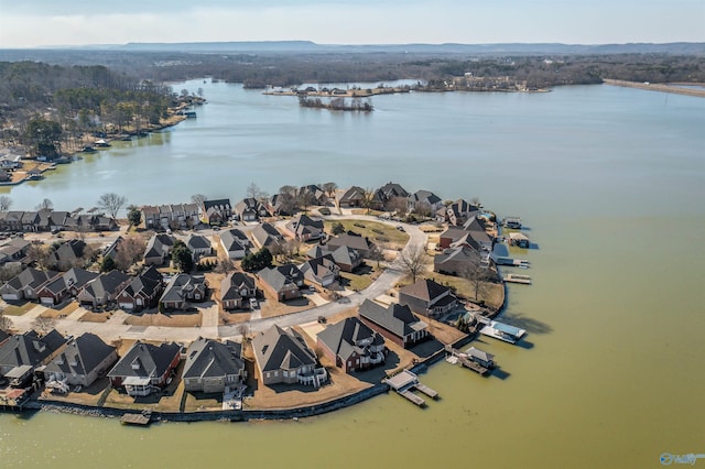 drone / aerial view featuring a water view and a residential view