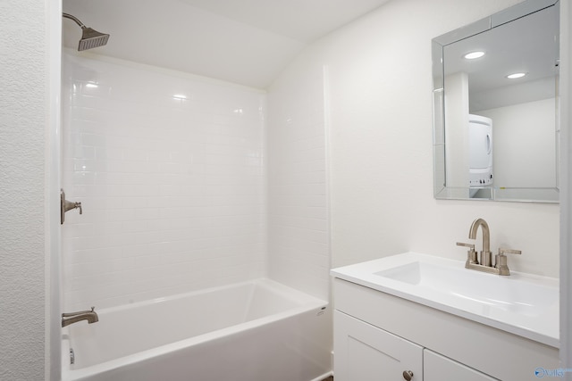 full bath with stacked washing machine and dryer,  shower combination, vanity, and recessed lighting
