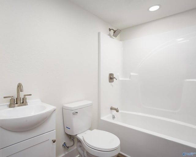 bathroom with toilet, vanity, and shower / tub combination