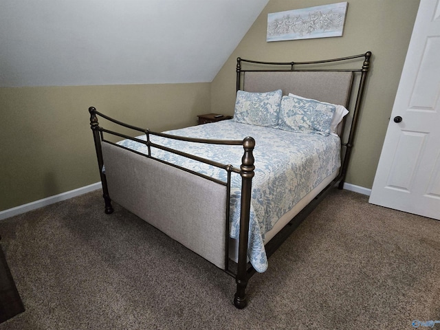 bedroom featuring lofted ceiling and carpet floors