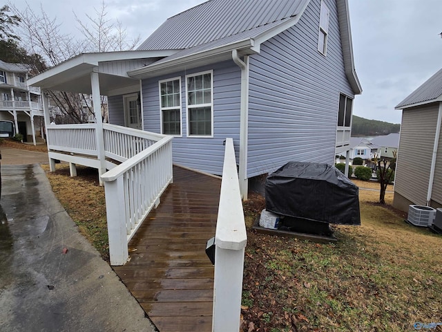 view of side of home featuring cooling unit