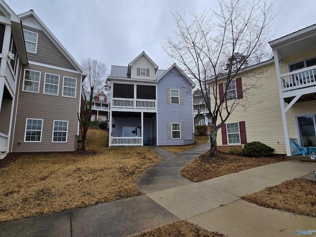 view of front of house with a sunroom