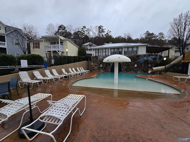 view of swimming pool featuring a patio area