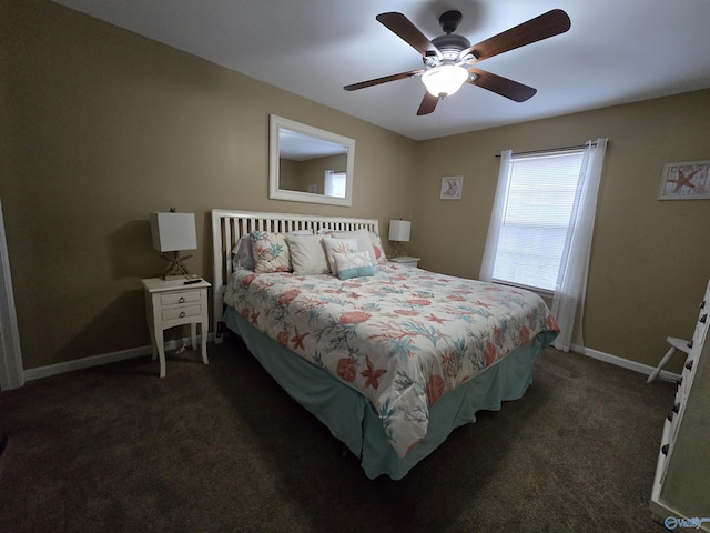 bedroom with ceiling fan and dark colored carpet